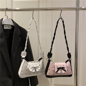 Chic underarm bags in white and pink with bow prints and heart metal charms