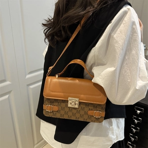 Retro monogram crossbody bag in caramel brown with gold metal lock and elegant top handle