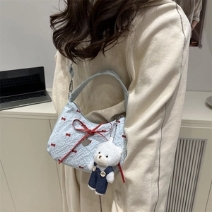 Blue hobo shoulder bag with red bow pattern and cute teddy bear charm pendant