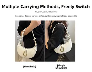 Detail of white woven hobo bag featuring golden horseshoe buckle and knotted shoulder strap