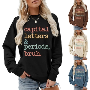 Detailed view of the colorful slogan print on a long sleeve crewneck sweatshirt