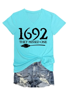 Detail view of V-neck tee with 1692 graphic print and knot style tied at the hem
