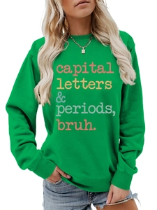 Detail of green crewneck sweatshirt featuring colorful capital letters printed graphic