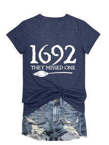 Detail of navy V-neck t-shirt with white 1692 they missed one text and broom print