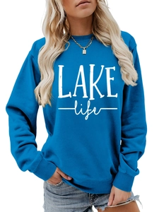 Detail of blue crewneck sweatshirt featuring white LAKE life printed art text