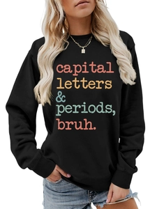 Detail of black crewneck sweatshirt with colorful capital letters and periods print