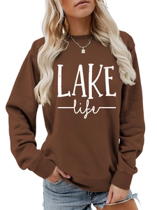 Close-up of Lake Life graphic print on a brown crewneck sweatshirt for women