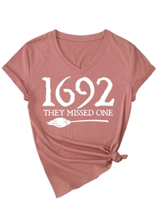 Detail of V-neck dusty rose T-shirt with 1692 They Missed One print and front knot tie