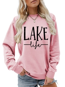 Detail of pink crewneck sweatshirt with black LAKE life print and ribbed cuffs