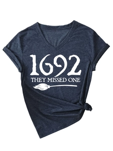 Macro shot of V-neck grey tee featuring 1692 broom print and soft heather texture