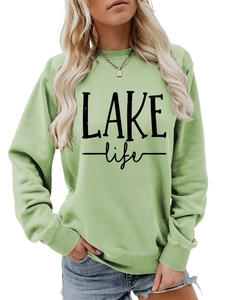 Close-up of Lake Life printed logo and ribbed crew neck on light green casual sweatshirt