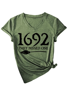 Close-up of V-neck dark green T-shirt with 1692 they missed one text and broom print