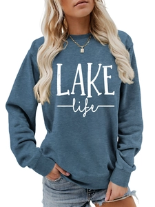 Close-up of Lake Life lettering on dusty blue crewneck sweatshirt with a vintage finish