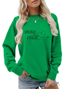 Detail of Vacay Mode print and airplane graphic on bright green long sleeve sweatshirt