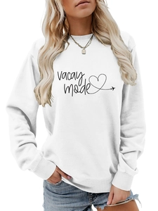 Close-up of white crew neck sweatshirt featuring vacay mode print and heart graphics