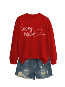 Flat lay of red vacay mode sweatshirt with heart print and distressed denim shorts
