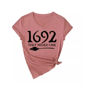 Women V-neck t-shirt in dusty rose with 1692 witch theme graphic and side knot detail