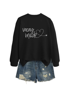 Close-up of Vacay Mode sweatshirt set with heart graphics and distressed denim shorts