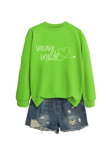 Neon green sweatshirt with Vacay Mode print paired with distressed denim shorts