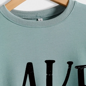 Teal crewneck sweatshirt with vintage ALIVE letter print on wooden hanger M size