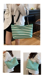 Three-way view of a green and white striped canvas tote bag with black leather straps