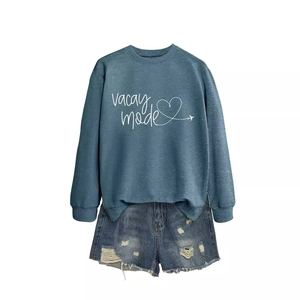 Blue crew neck sweatshirt with Vacay mode heart print and ripped denim shorts outfit