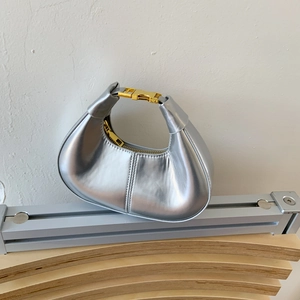 Chic silver crescent hobo handbag with gold buckle and stylish metallic leather finish