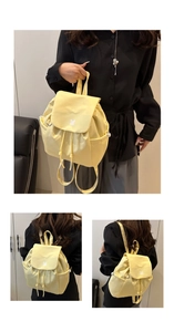 Detailed views of light yellow nylon mini backpack with drawstring and side pockets