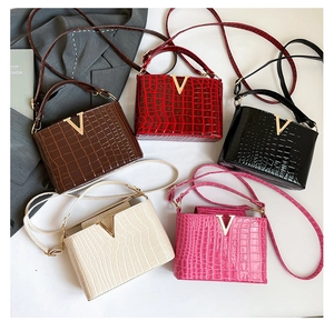 Collection of crocodile pattern crossbody bags with gold V-buckle in five vibrant colors