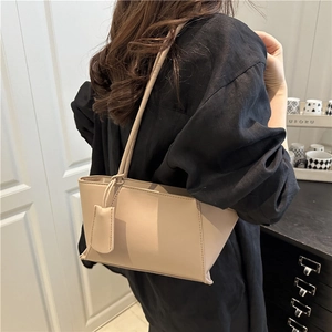 Beige rectangular PU leather shoulder bag with fine stitching shown from back view