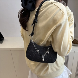 Chic black sequin underarm bag with silver decorative chain and leather knot strap