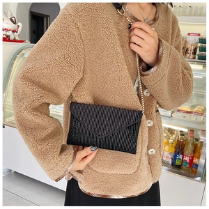 Chic black envelope bag with white polka dot rhinestones and slim metal chain strap