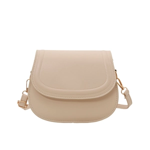 Chic beige saddle bag in smooth PU leather with gold hardware on white background