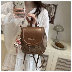 Brown mini backpack featuring metal chain, IBCMB embroidery, and plush sheep charm