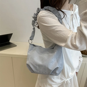 Chic light blue ruched strap shoulder bag featuring a cute bear print and compact design