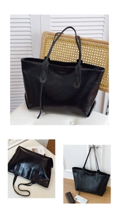 Detail of a black glossy PU leather tote bag showing large capacity and minimalist straps