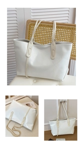 Detail of reinforced stitching on the long straps of this large cream tote bag