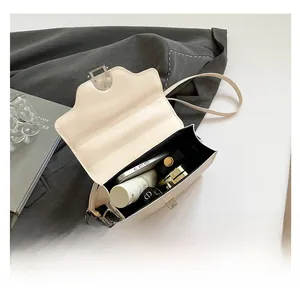 Detailed view showing the spacious interior compartments of the white PU leather handbag