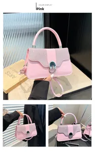 Detail of pink fashion handbag featuring sequin flap and silver metallic arc lock