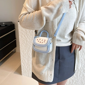 Cartoon cherry print handbag in blue and white contrast with adjustable shoulder strap