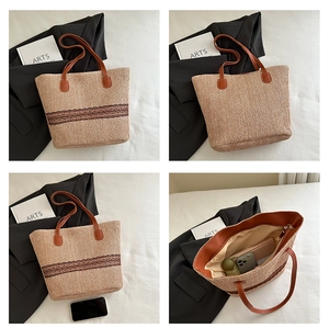 Macro shot of large straw tote bag with brown lace trim and spacious interior detail