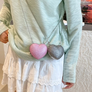Mini heart-shaped sequin crossbody bag with metal chain strap for women in pink and silver