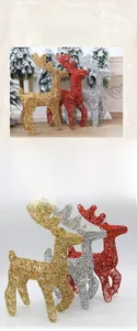 Detail of handcrafted 25cm iron Christmas deer ornaments in gold, silver and red finishes