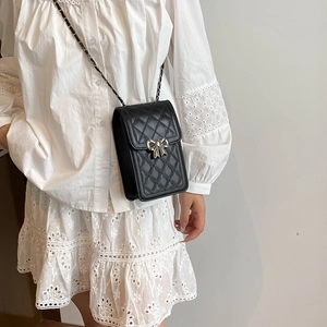 Mini black quilted square crossbody bag with a silver bow and chain strap for women