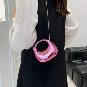 Pink metallic pebble-shaped crossbody bag with gold chain strap for evening wear