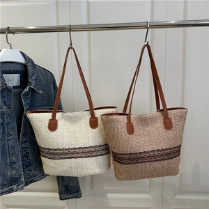 Large capacity straw tote bag with black lace trim and brown leather straps in two colors