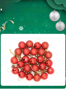 Detail of red Christmas ball ornaments with matte, glitter, and glossy finishes with gold strings