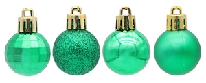 Detail of 4 green Christmas ball textures: glitter, matte, shiny and faceted prism finishes