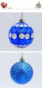 Detail of blue Christmas baubles featuring glitter dots and embossed texture with silver caps
