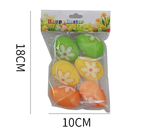 Detail view of 6 colorful Easter eggs with daisy patterns and hanging strings in packaging